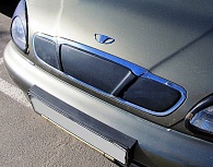 Зимняя накладка на решетку радиатора для Chevrolet Lanos '2005-2009 (верхняя решетка) глянцевая FLY
